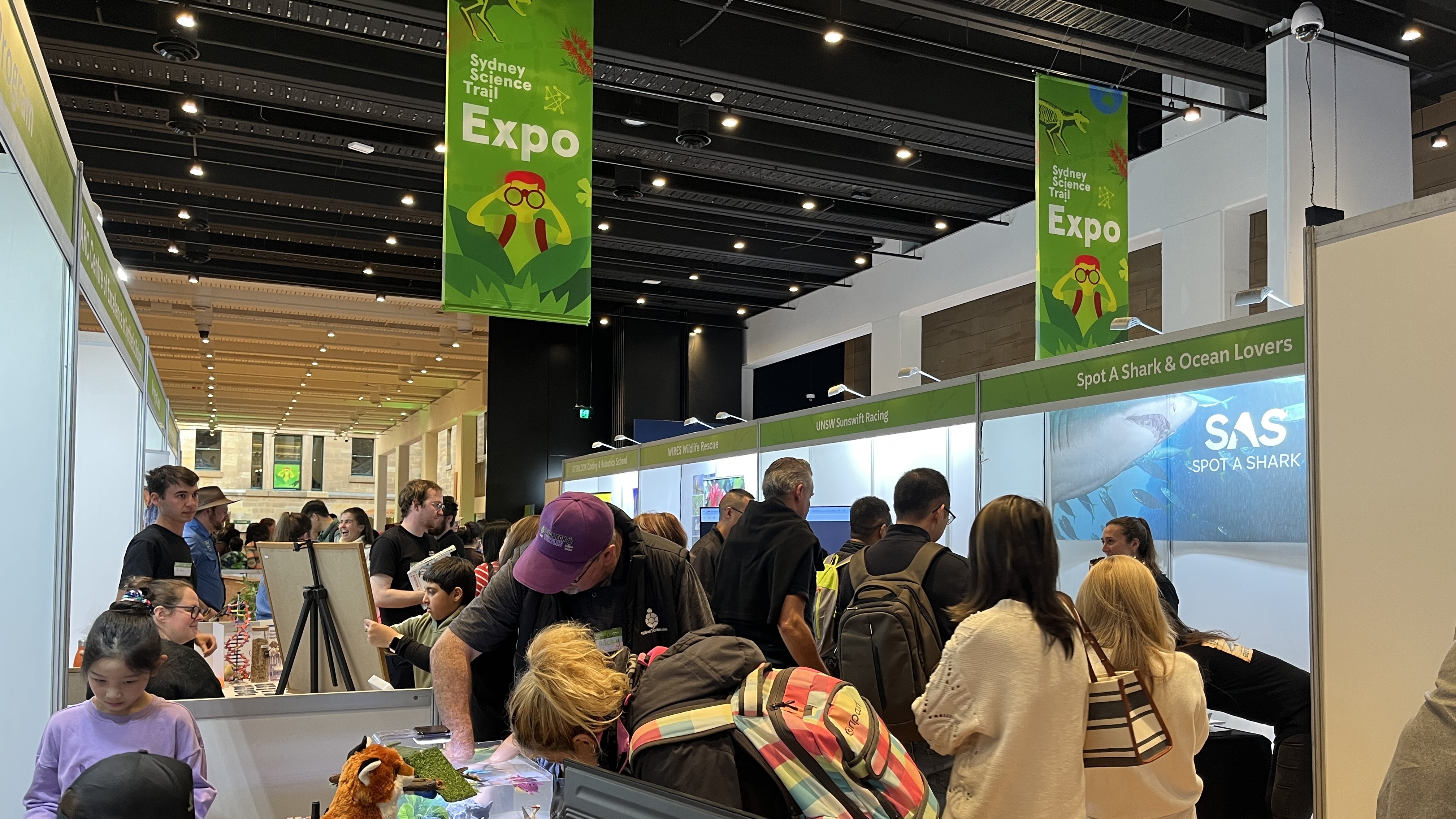 group of people inside at displays